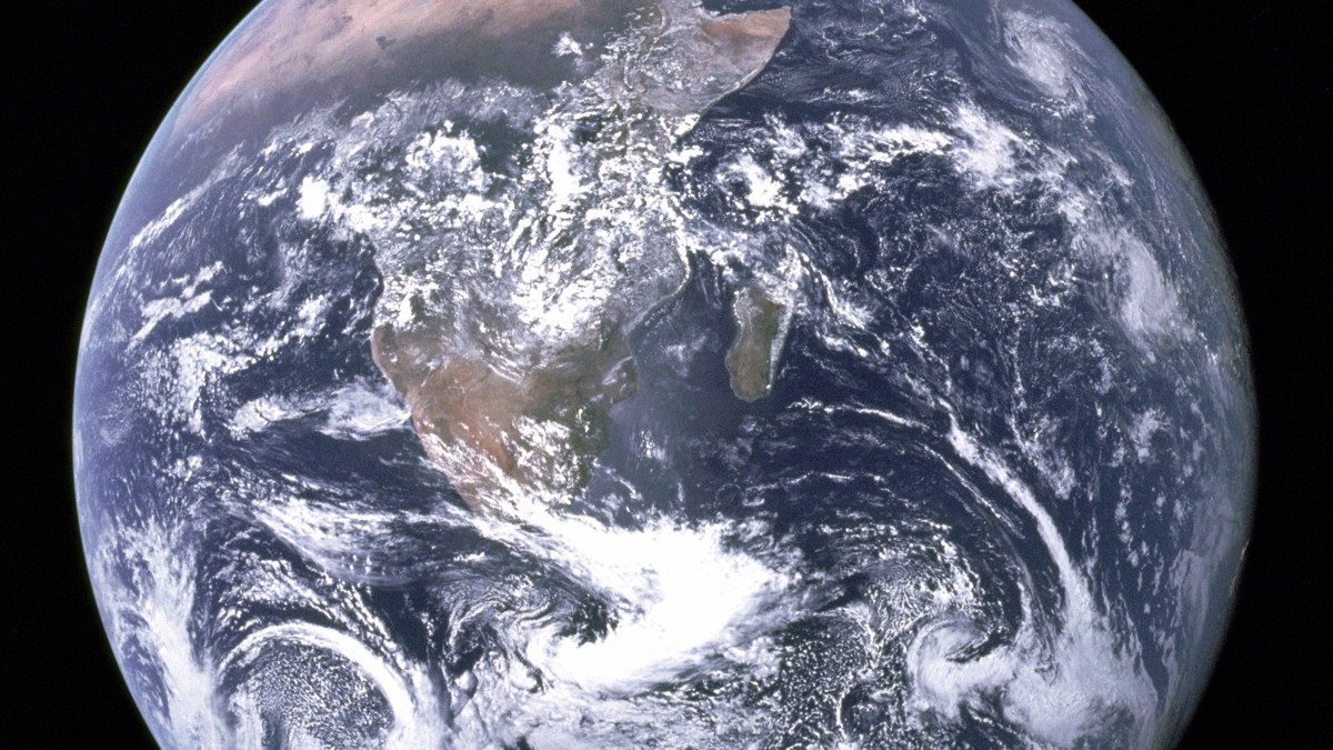 Full illuminated disk of spherical Earth photographed from space with Africa and Antarctica visible.