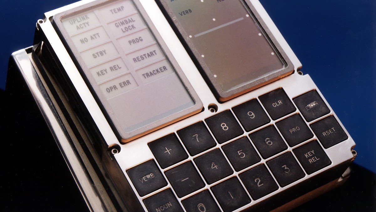 An Apollo-era display and keyboard unit with a numeric keypad, warning lights and green digit displays.