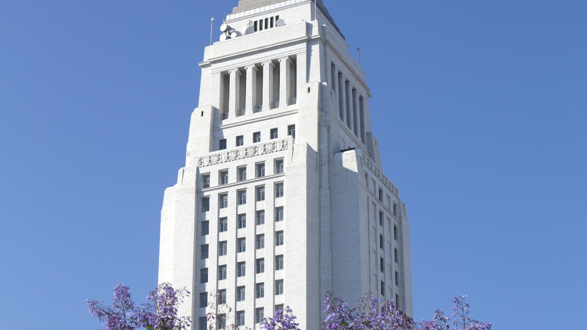 Part of the white tower of Los Angeles City Hall.